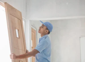 worker installing new door